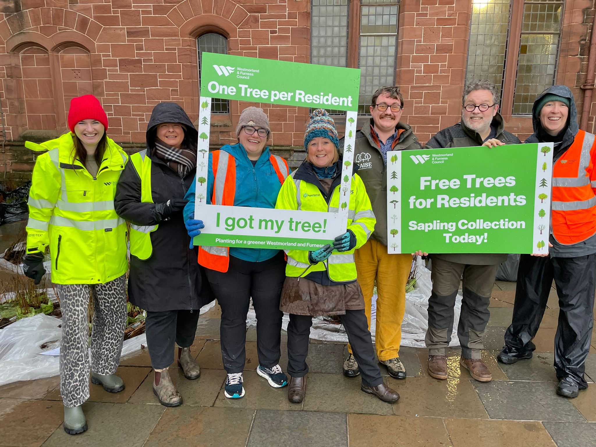 A collective of people from Westmorland & Furness Council - handing out free trees